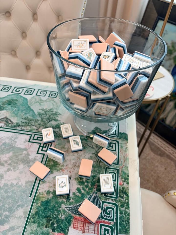 Blush, white, and navy layered tiles in a glass trifle bowl on a green chinoiserie landscape mat
